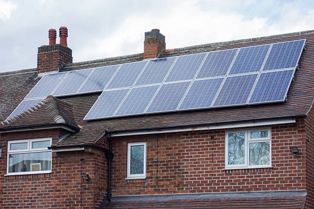 istock Suburban house with solar panels. 465653559