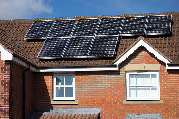 istock Suburban house with solar panels. 465653561