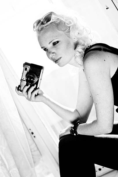 istock woman photographer with camera 465654637