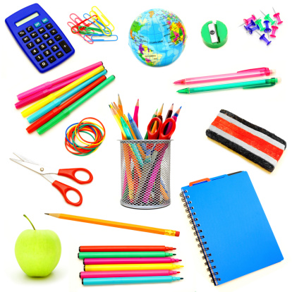 Assortment of school supplies individually isolated on white