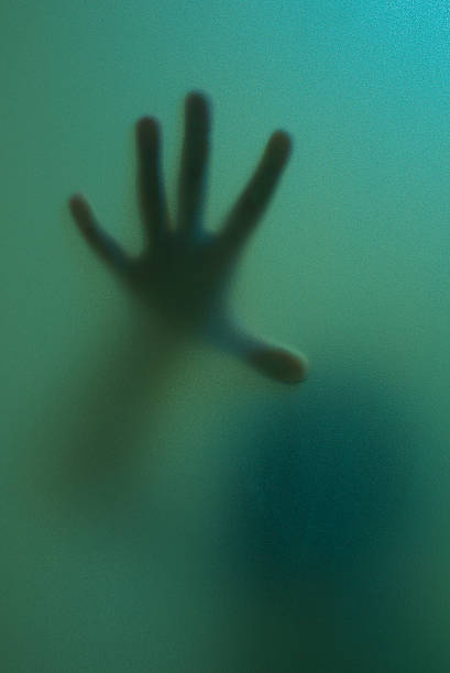 istock finger touch to frosted glass 465655949