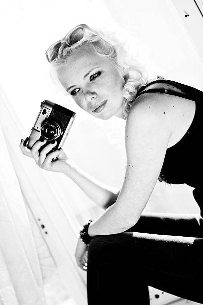istock woman photographer with camera 465656473