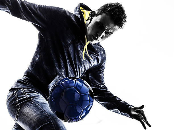 istock young man soccer freestyler  player silhouette 465656691