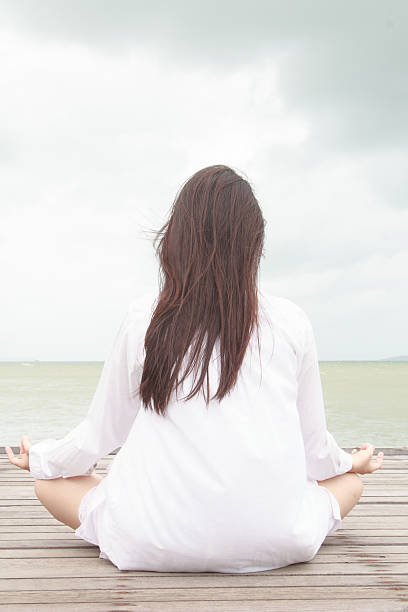 istock Meditation by young women 465656849
