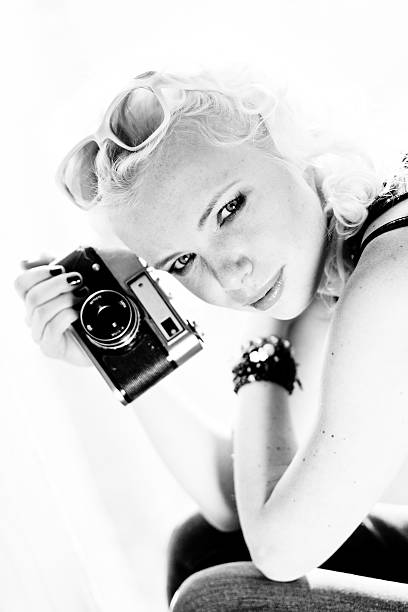 istock woman photographer with camera 465656919