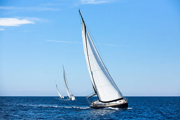 istock Sailing ship yachts with white sails. Luxury yachts. 465659212