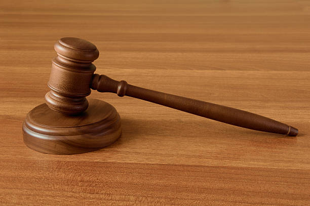 Gavel on wood surface stock photo