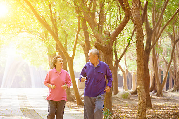 istock Senior Couple Exercising In Park 465659656