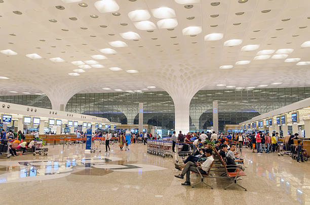 Crowd at Chhatrapati Shivaji International Airport. Mumbai, India - January 5, 2015: Crowd at Chhatrapati Shivaji International Airport. The New Terminal 2, International Departures on January 5, 2015 in Mumbai, India. Skidmore, Owings and Merrill (SOM) was the architectural designer of the project. india airport stock pictures, royalty-free photos & images