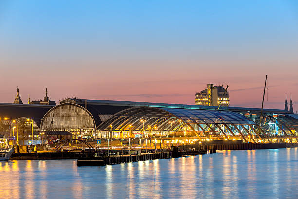 istock Amsterdam Grand Central station at sunset 465664096