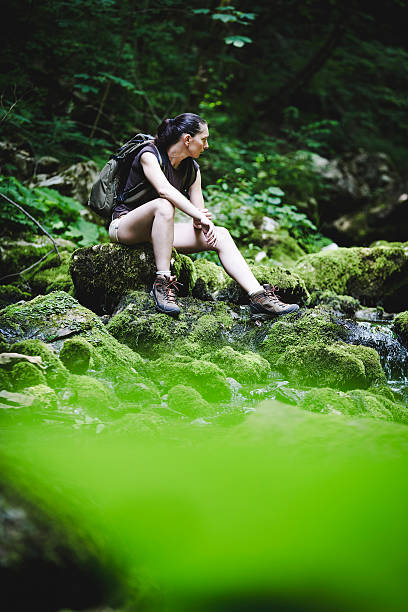 istock hiker relaxing in a wood 465667307