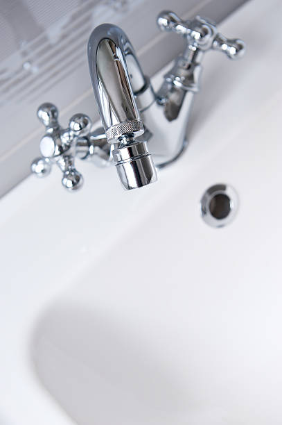 istock Steel faucet in a bathroom 465667664