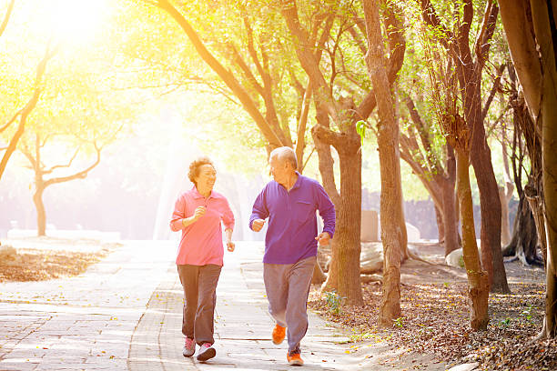 istock happy Senior Couple Exercising In the Park 465670784
