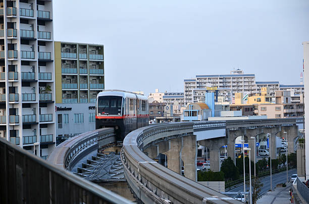 Naha City, Okinawa, Japan - November 26, 2013: The monorail in Naha City approaches a station. From the japanes island Okinawa. The Japanese island Okinawa is one of Japan´s southernmost islands. The climate at Okinawa is subtropical and the beaches are considered among the world´s most beautiful.