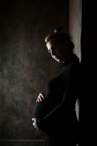 Pregnant girl in black tight clothes