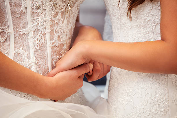 istock Two brides in wedding dresses holding hands 465676087