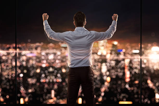 King of the world Young successful businessman standing in front of the city passion stock pictures, royalty-free photos & images