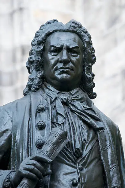 Johann Sebastian Bach bronze statue standing outside St Thomas Church in Leipzig, Germany