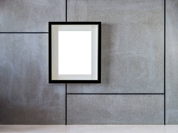 istock Blank black hanging picture frame on modern wall background 465678950
