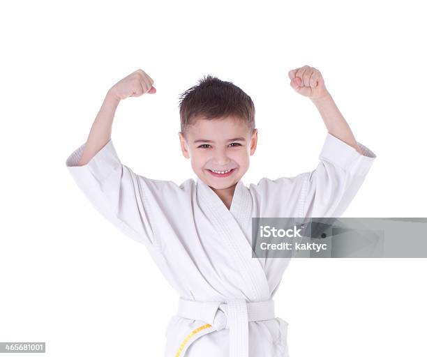 Young Boy Fighter In Kimono With Hand Up Stock Photo - Download Image Now - Child, Judo, Boys
