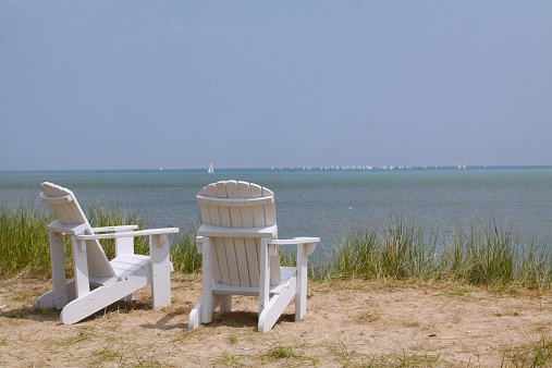 Two chairs on the shores of Lake Michigan