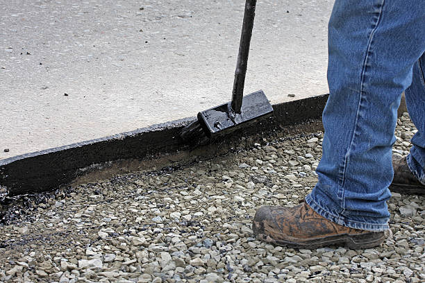 istock Applying Hot Tar On A Road Repair Site 465690326