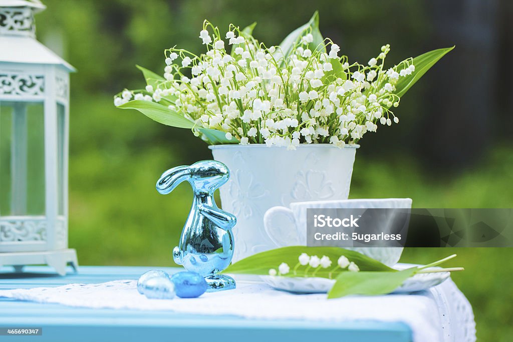 Bouquet of lilly-of-the-valley with easter decorations Bouquet of lilly-of-the-valley with easter decorations in a garden Backgrounds Stock Photo