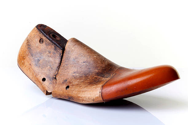 Closeup of wooden shape model Traditional wooden shoe last with black background shoe mold stock pictures, royalty-free photos & images