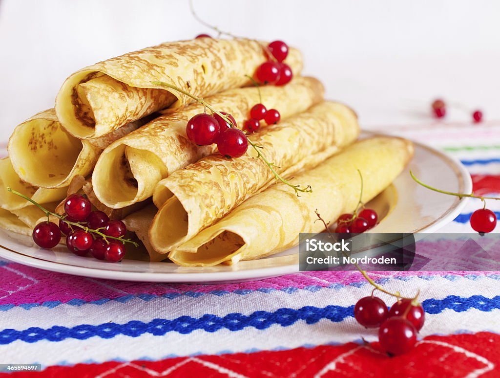 stack of pancakes with red currant. stack of pancakes with red currant. On a round plate. Baking Stock Photo