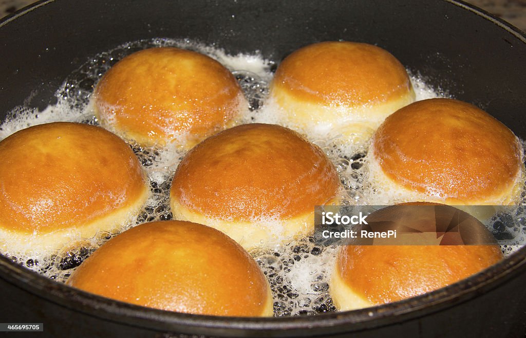 Baking Donuts In A Pan Original homemade Carinthian Carnival Donuts, or so called "Faschingskrapfen", filled with apricot jam. Jelly Doughnut Stock Photo