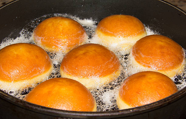 Baking Donuts In A Pan stock photo