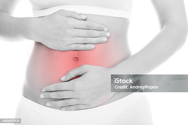 Woman Suffering From Stomach Ache Stock Photo - Download Image Now - Stomachache, Women, One Woman Only