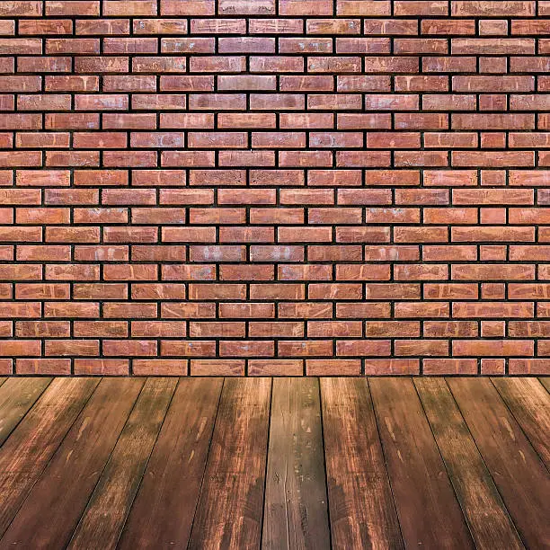 Darkwood floor and orange bricks wall