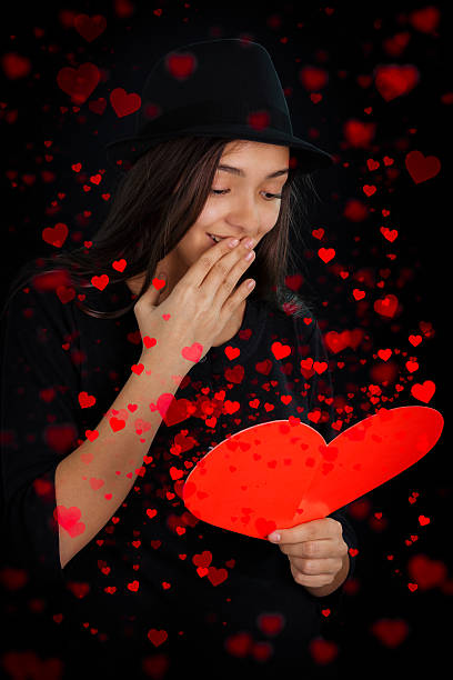 istock Girl Reading Valentine's Day Card 465697301