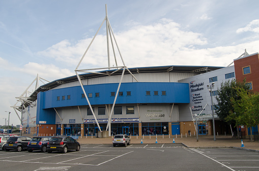 Reading, UK - September 14, 2014:  Main entrance to the Madejski sports stadium in Reading, Berkshire.  Home for Reading Football Club and London Irish Rugby Club.  View from public pavement.