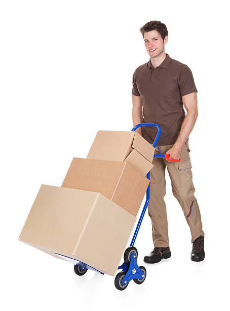 istock Delivery Man With Hand Truck And Boxes 465698893