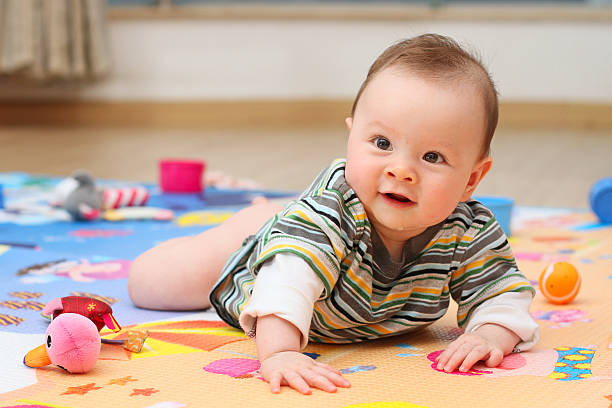 istock Cute Baby Playing on her playmat 465698908