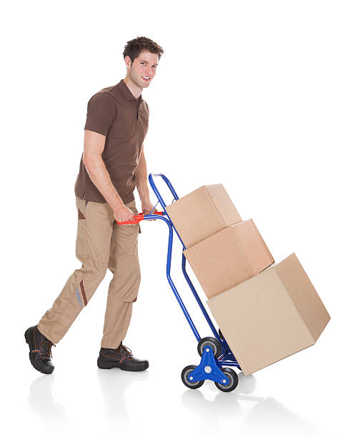 istock Delivery Man With Hand Truck And Boxes 465698961