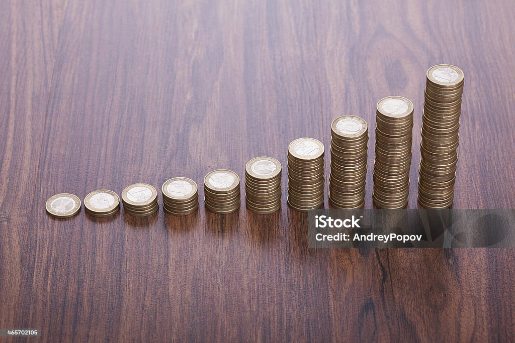 Stacks Of Coins Stack Of Coins In A Row On Wooden Table Banking Stock Photo