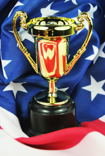 Golden cup against the United States of America flag
