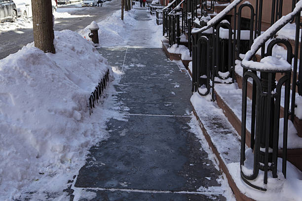 istock Snow shoveled off a Brooklyn bluestone sidewalk 465707312