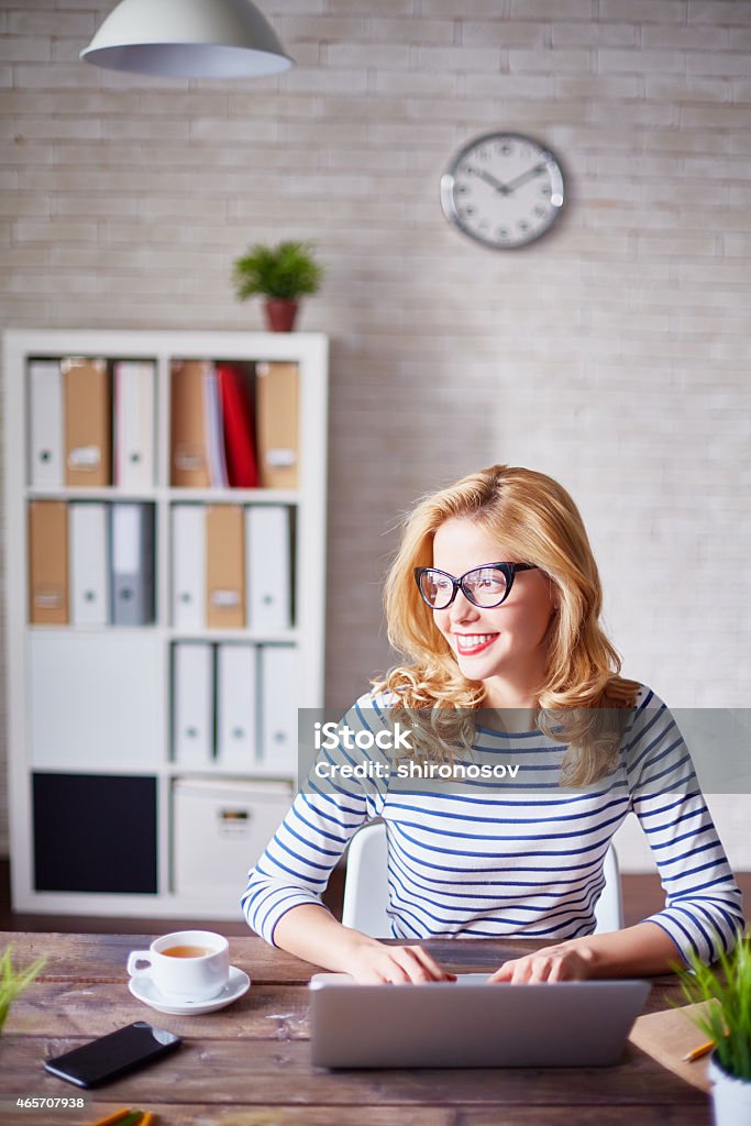 Secretary at work Charming secretary working in office 2015 Stock Photo