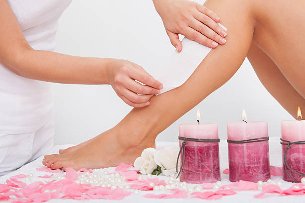 istock Beautician Waxing A Woman's Leg 465709641