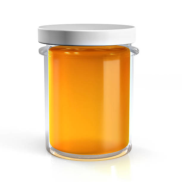 istock Honey glass jar isolated on white background 465714156