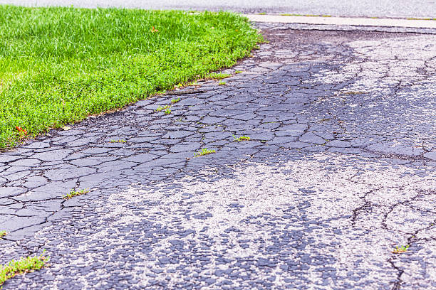 istock Blacktop Asphalt Driveway Damaged and Cracked 465719504