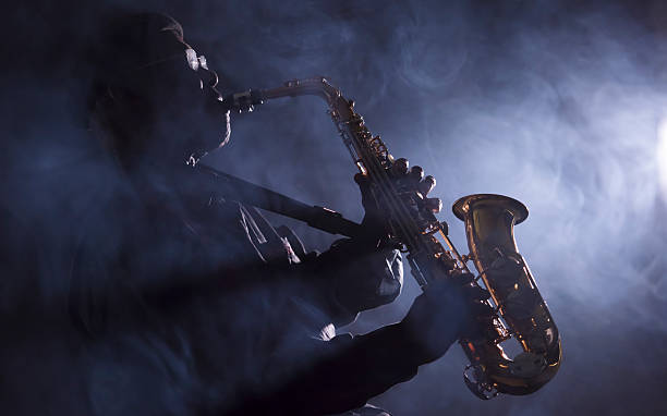 istock African jazz musician plays saxophone with smoke 465721832