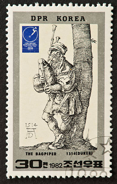 istock Durer's The Bagpiper Stamp 465723327