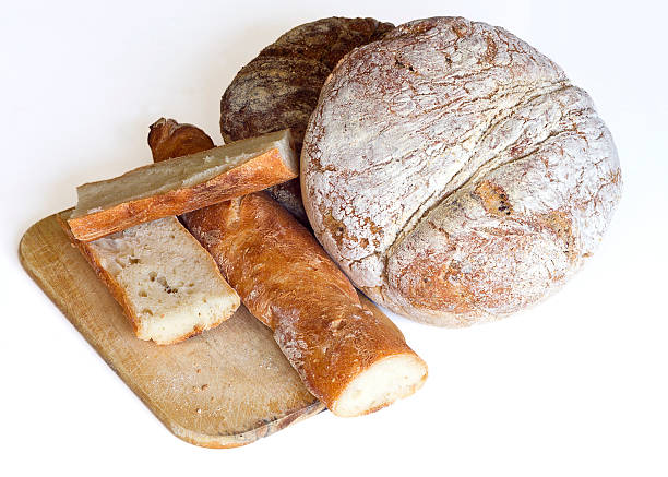 istock Two Loaves of Rye Bread and baguette isolated on white 465724574