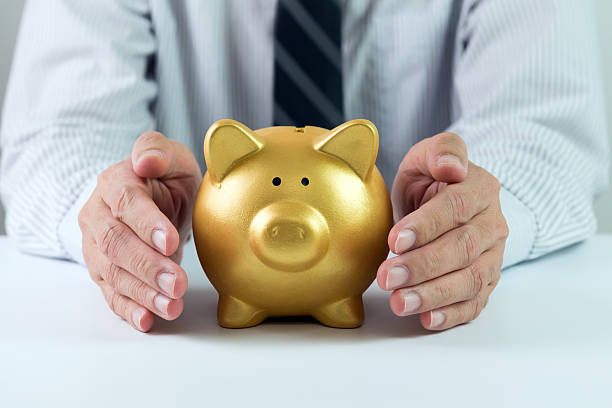 istock A man with a golden piggy bank 465732456
