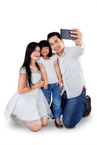 istock Asian family taking self picture 465738904